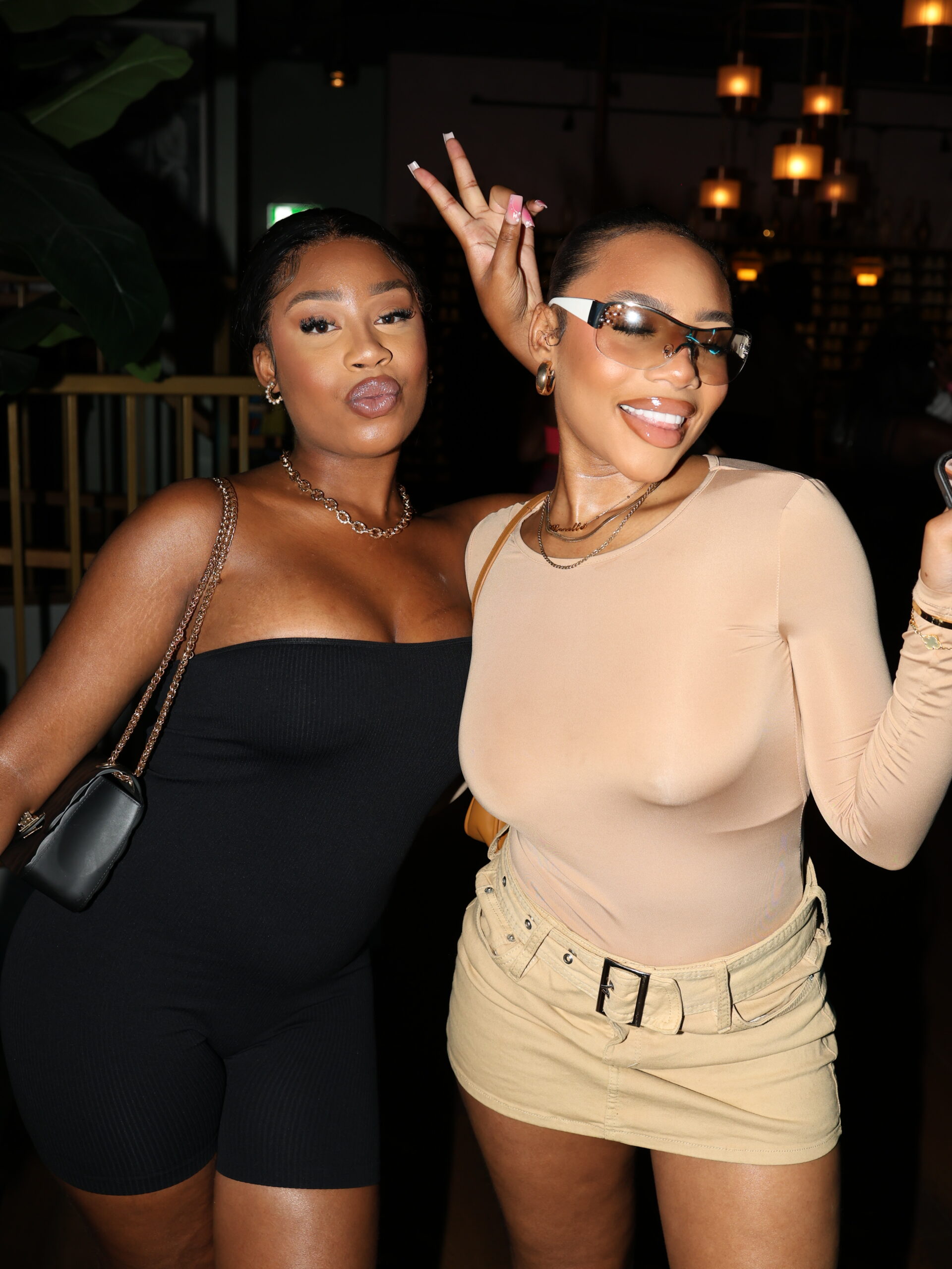 Two women pose at BennyBoys The Bowl Event.